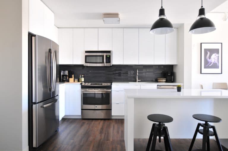 kitchen with nice appliances and white cabinets