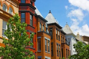 Historic row houses with blue skies above