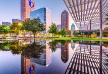 20 Dallas Fun Facts You Might Not Know Dallas skyline with water and building in front