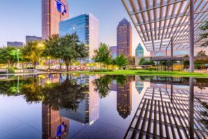 Dallas skyline with water and building in front