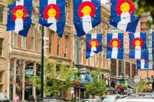 larimer square with colorado flags billowing and hanging from light strings