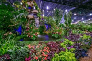 tropical flower arrangement and set up with waterfall at flower show