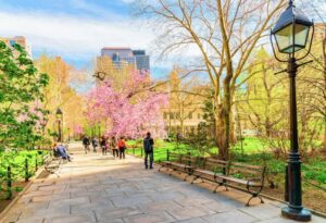 Tourists walking in City Hall Park of Lower Manhattan