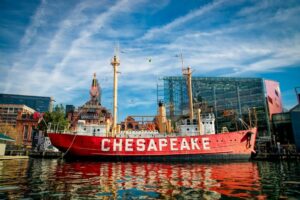 red boat reading chesapeake in the inner harbor of baltimore