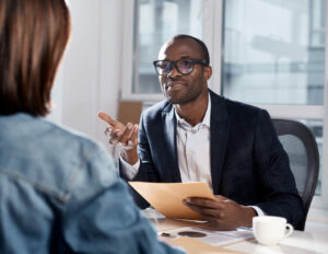 man talking to woman across from him