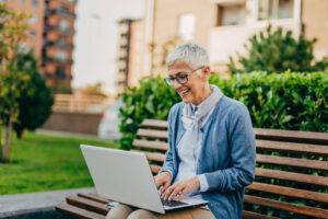 woman working on laptop outside