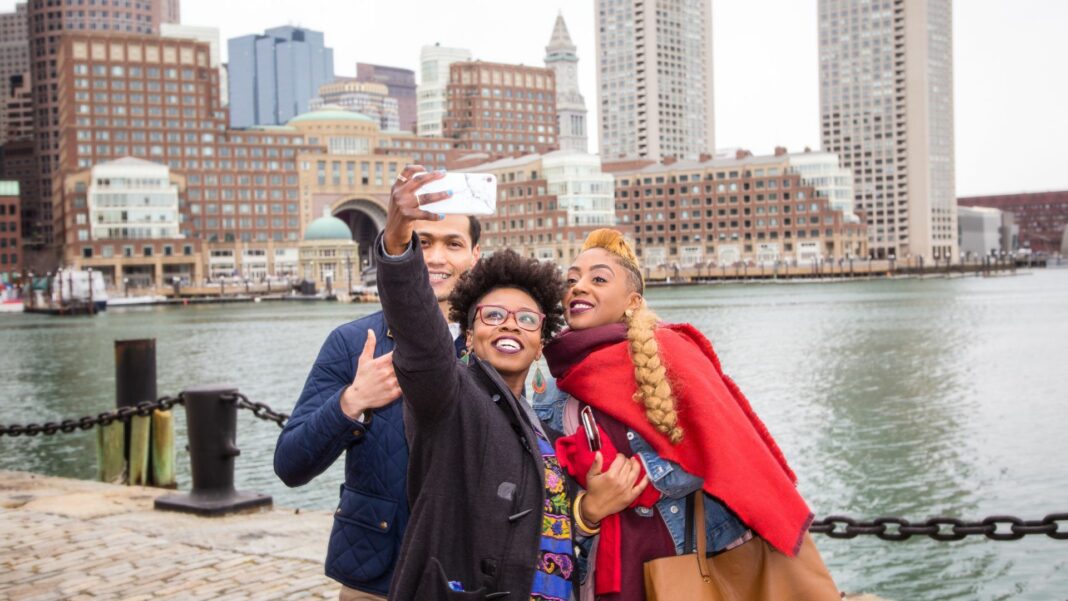 Mixed group of people in Boston taking a photo