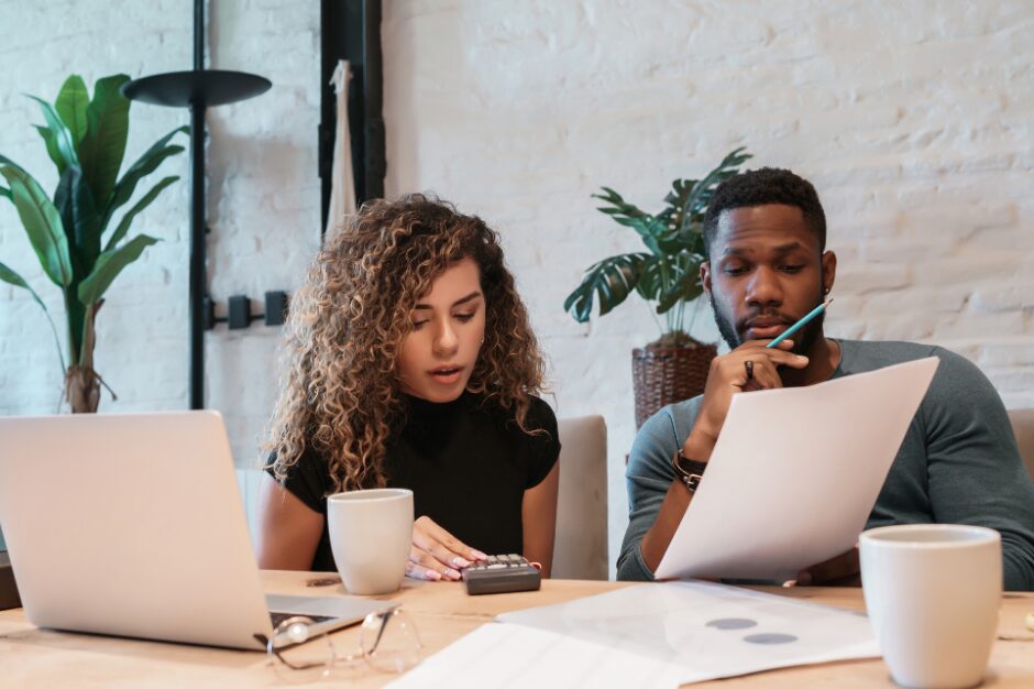 two people at a table planning their budget