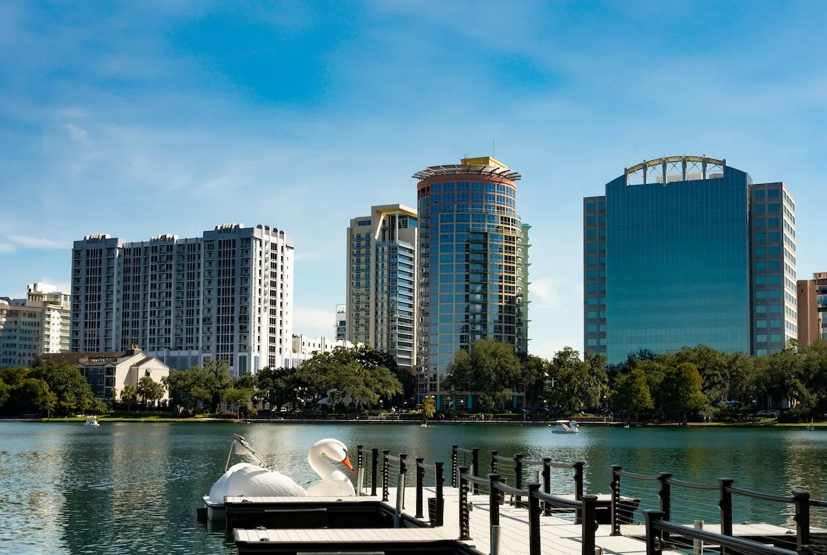 Downtown Orlando skyline with Lake Eola in the foreground, representing the urban rental landscape and housing costs for Orlando renters in 2025