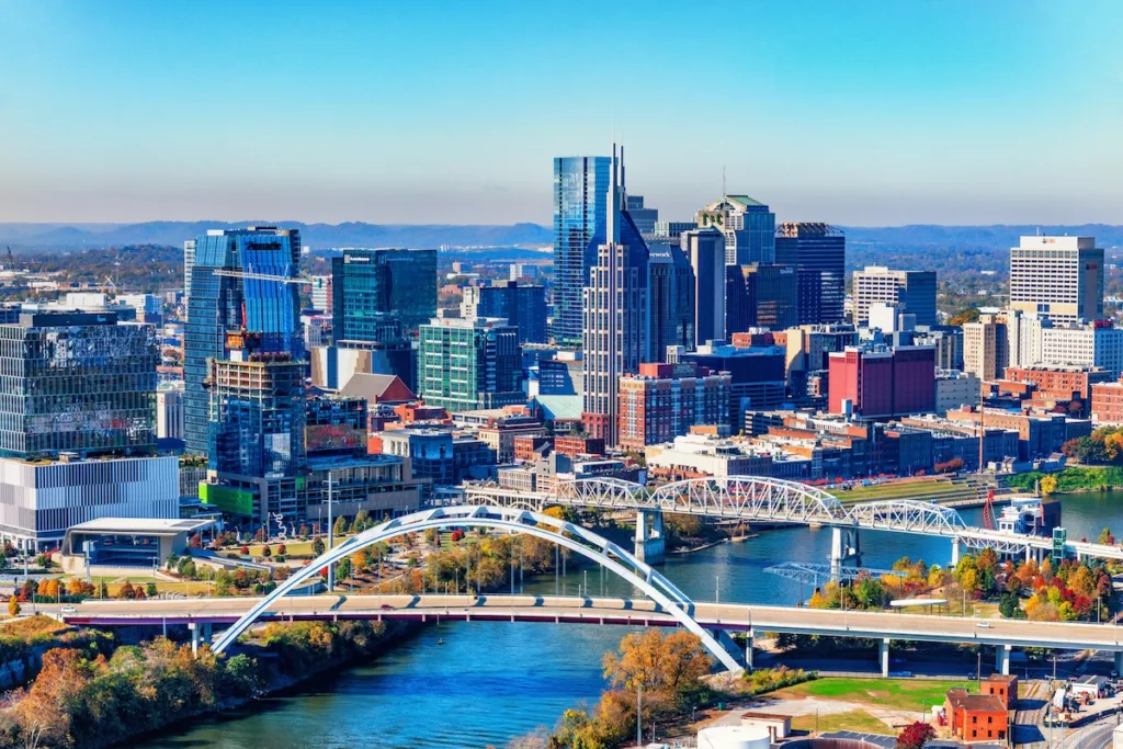 Downtown Nashville skyline and Cumberland River bridges, representing the city layout and neighborhoods renters compare when looking for cheaper areas to live.