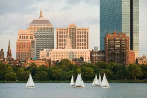 Greater Boston area map showing affordable rental cities including Cambridge, Somerville, Quincy, Newton, Milton, and Dedham with transit connections