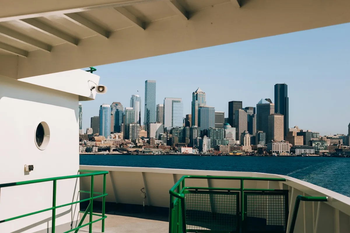 Seattle skyline seen from a ferry traveling toward downtown, commonly used by commuters from nearby cities.