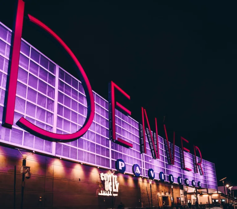 Denver Pavilions entertainment district at night - accessible from affordable neighborhoods like Capitol Hill and Uptown